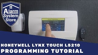 How To Program The Honeywell Lynx Touch L5210  Alarm System Store [upl. by Asilav]