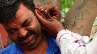 Ear Waxing  Traditional ear cleaner in India [upl. by Kevina931]